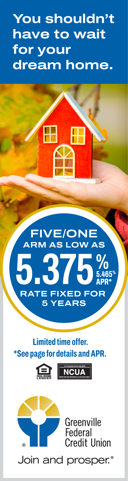 image An advertisement with an image of a hand holding a small scale house.